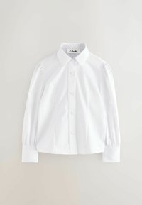 Weiße Baumwollbluse mit Kragen, Knopfverschluss vorne und Puffärmeln. Hat dekorative Nähte entlang der Knopfleiste.