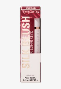Silk blushkremstift i "Berry Flush," med en hvit applikator med gullaccent. Emballasjen er rød med hvit og gull skrift. 4,25 g.