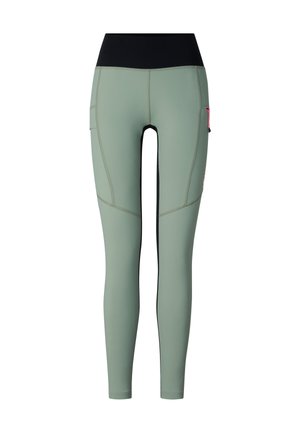 High-waisted, sage green full-length leggings with a black waistband and a zippered pocket on the right thigh.