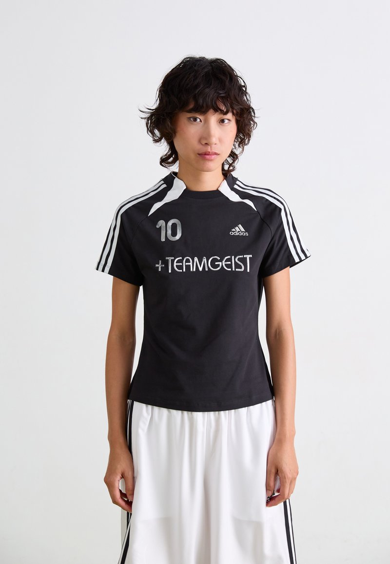 Black athletic shirt with white accents, featuring the number 10 and "+TEAMGEIST" text. Short sleeves and a crew neckline.