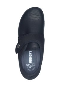 Scarpa nera in velcro con una superficie testurizzata, punta rotonda e soletta in memory foam. Presenta un design anti-shock e un logo discreto all'interno.