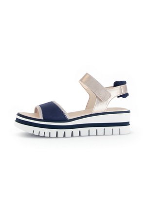 Navy and metallic gold wedge sandal with adjustable strap, wide heel, and textured outsole. Features a layered design and contrasting colors.