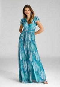 Robe maxi en imprimé abstrait bleu et vert, avec un col en V, de courtes manches bouffantes, une taille froncée et une fente sur le côté, fabriquée en tissu lisse.