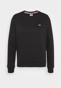 Černá mikina s kulatým výstřihem a dlouhými rukávy, s žebrovanými manžetami a lemem, a malým logem Tommy Hilfiger na hrudi.