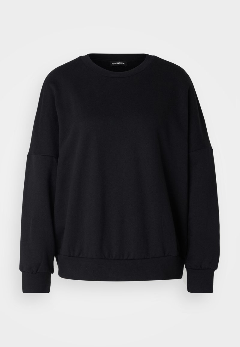 Felpa nera con collo rotondo, vestibilità rilassata, spalle scese, polsini a costine e un tessuto texture. Design minimalista senza motivi.