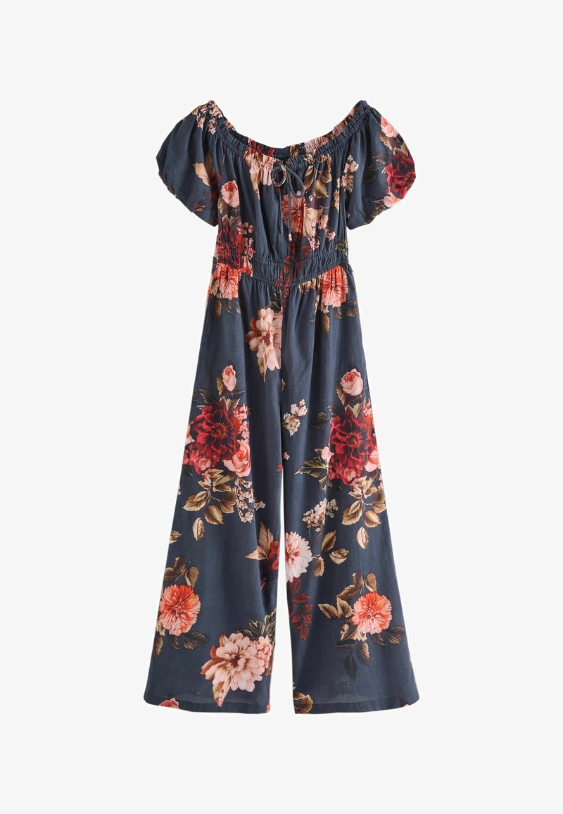 Bloemenjumpsuit in donkerblauwe stof met korte pofmouwen, elastische taille en een levendige mix van rode, roze en crèmekleurige bloemen.