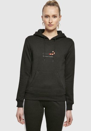 Hoodie noir en mélange de coton, avec une poche avant et des cordons de serrage. Il présente un graphisme de canne en sucre imprimé et du texte sur la poitrine.