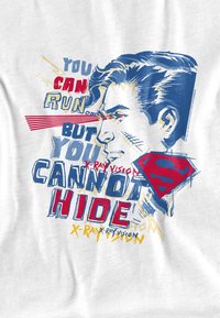 White graphic t-shirt featuring a colorful print of a man's profile, text in red, blue, and yellow, and a red Superman logo.