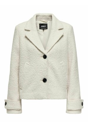 Casaco cropped branco em mistura de lã com acabamento texturizado, botões pretos e lapela em pico; apresenta dois bolsos frontais e detalhes nos punhos.