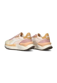 Sport shoes with a mixed materials design: beige upper, pink and tan accents, white sole, and textured outsole. Branding on heel.