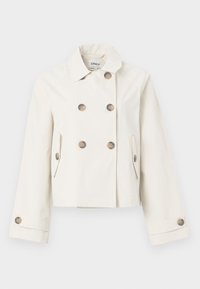 Veste croisée de couleur crème avec six boutons marron, deux poches latérales, manches longues et col style chemise.