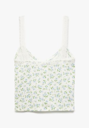 Camiseta sin mangas blanca con flores azules y hojas verdes sobre un fondo claro. El borde de encaje y las tiras ajustables añaden un toque de detalle.