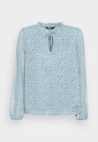Blouse bleu clair à motif floral, avec une encolure en trou de serrure, des manches longues et un détail d'encolure froncée. Fabriquée dans un tissu transparent.