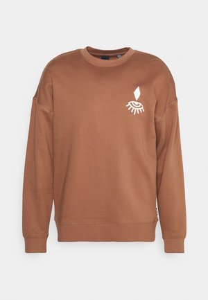 Sweat-shirt marron à manches longues avec col rond et un motif blanc représentant un œil fermé et une larme sur la poitrine gauche.