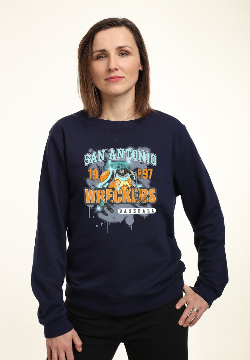 Sudadera azul marino con un gráfico colorido que dice "San Antonio Wreckers Baseball" y una ilustración de un robot en acción.