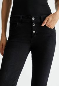 LIU JO WITH BUTTONS - Bootcut-teksad - black