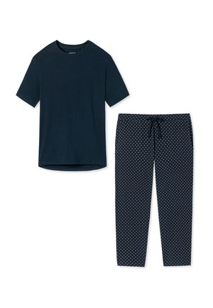 Maglietta in cotone navy a maniche corte abbinata a pantaloni navy con pois bianchi e vita regolabile con cordino.