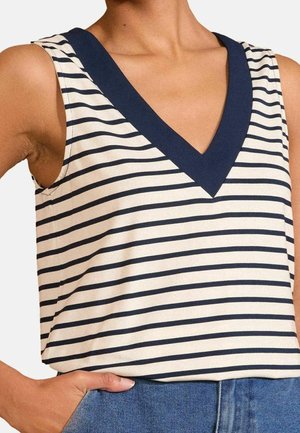 Top smanicato a righe in crema e blu navy con scollo a V. Realizzato in tessuto leggero, presenta un dettaglio di scollo a contrasto con una texture liscia.