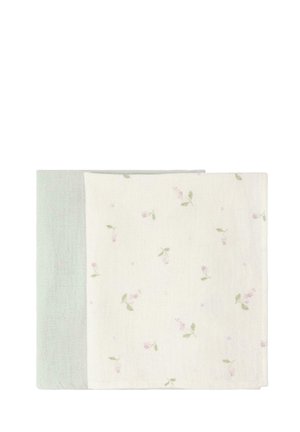 To foldede bløde stoffer, et ensfarvet lysegrønt og et hvidt med små lyserøde og grønne blomsterprint.