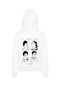 White hoodie featuring a graphic design with four black and white illustrations of a woman, captioned "I AM MY OWN MUSE," by Frida Kahlo.