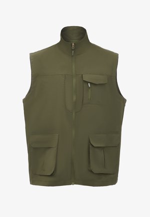 Vesti oliivivärviga, millel on kõrge krae, täispikk tõmblukk ja neli taskut (kaks rinnal, kaks vööl), valmistatud siledast kangast.