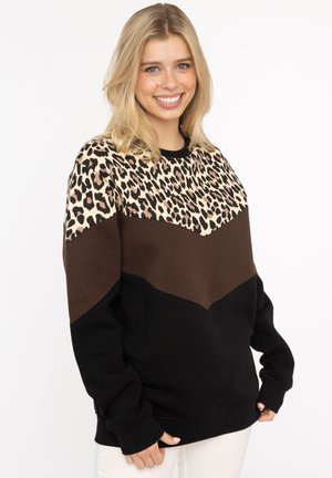 Schwarzer, brauner und beiger Sweatshirt mit einem oberen Abschnitt im Leopardenmuster und Chevron-Design. Weicher Stoff und lässige Passform mit langen Ärmeln.