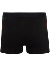 Black boxer shorts featuring a black waistband, contrasting red stitching along the sides, and a smooth fabric texture.