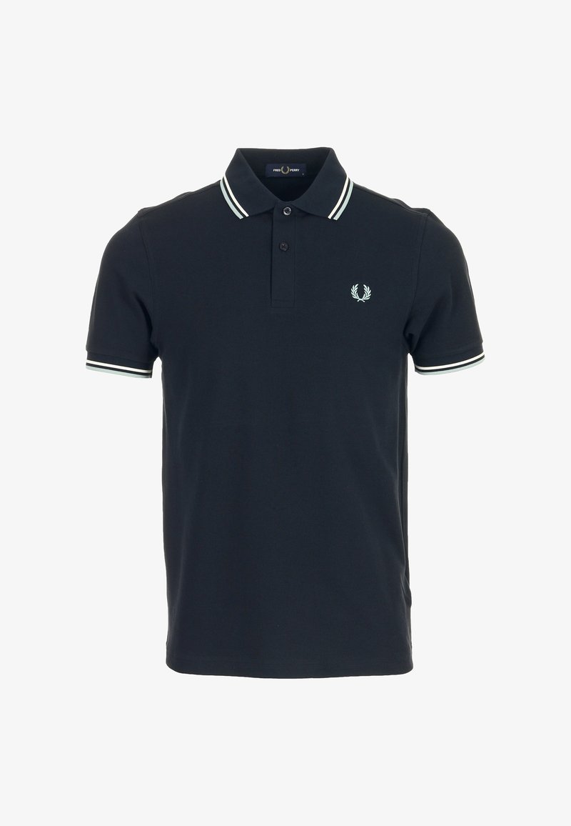 Polo noir à manches courtes avec double bandes blanches au col et aux poignets, patte à deux boutons et petit logo laurier brodé sur la poitrine.