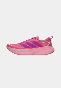 Bright pink running shoe with purple stripes, thick cushioned sole, and pull tab on white background, side view.