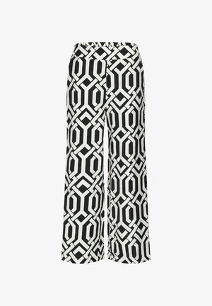 Pantalones de pierna ancha en blanco y negro con un patrón geométrico de diseños hexagonales. Confeccionados con tejido ligero. Cintura elástica.