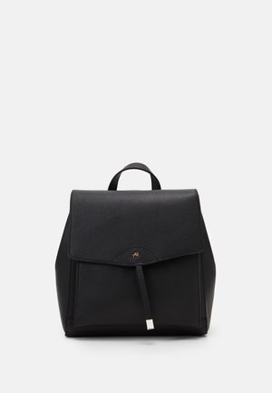 Black leather backpack with flap closure, top handle, and subtle metallic logo detail on front center.