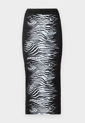 Jupe noire avec un motif zèbre en blanc, ornée d'une taille texturée affichant le nom de la marque. Silhouette ajustée, longueur genou.