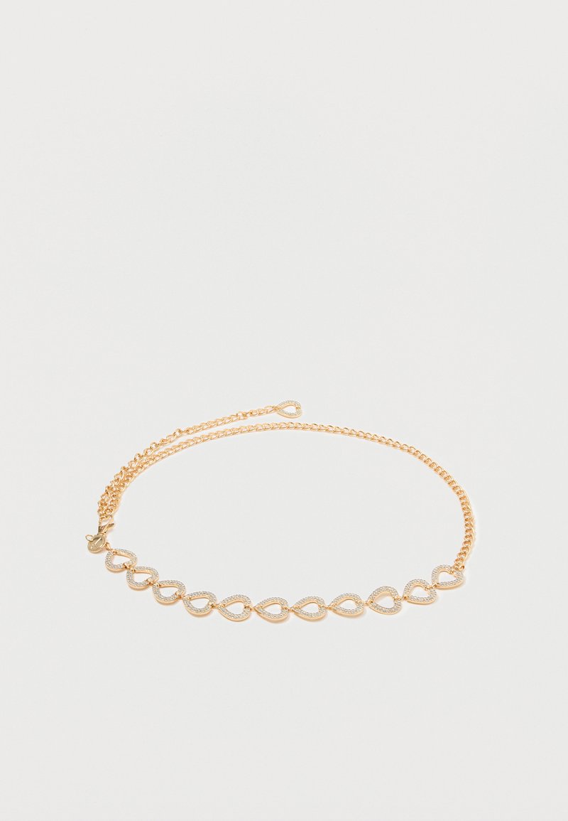 Guld halskæde med sammenkoblede ovale led, der har polerede og teksturerede overflader, forbundet med en fin kæde.