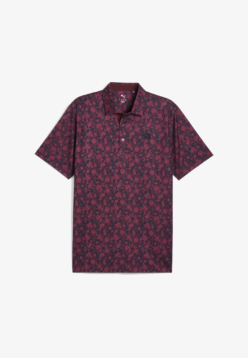 Polo a maniche corte di un colore bordeaux scuro con un motivo floreale, dotato di colletto, chiusura a tre bottoni e un tessuto morbido e testurizzato.
