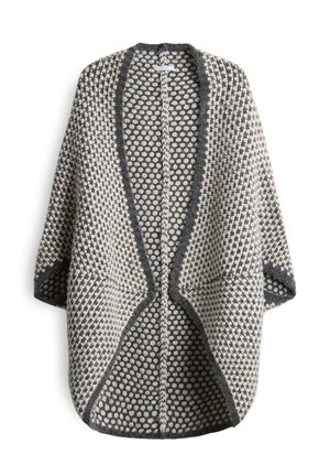 Flauschige Strickjacke mit Schwarz-Weiß-Punkte-Muster, offener Vorderseite, langen Ärmeln und dunklem Saum entlang der Kanten und des Kragens.