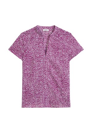 Koszulka z krótkim rękawem w intensywnym fioletowym kolorze z rozproszonym wzorem białych kropek. Posiada dekolt w kształcie litery V oraz lekką teksturę materiału.