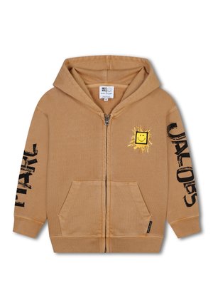 Felpa con zip color beige in morbido cotone, dotata di una tasca frontale, grande testo nero "JACOBS" su una manica e una grafica di un sorriso giallo sul petto.