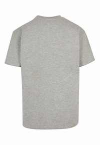 Grå kortærmet t-shirt lavet af blødt stof. Har en rund halsudskæring og en afslappet pasform med en glat, ensartet tekstur.