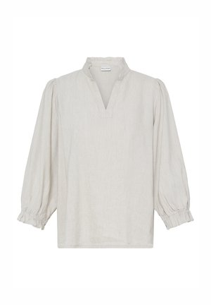Blouse beige clair à manches longues avec col volanté et poignets élastiqués froncés, dotée d'une ouverture frontale en forme de V.