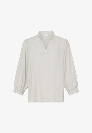 Blouse beige clair à manches longues avec col volanté et poignets élastiqués froncés, dotée d'une ouverture frontale en forme de V.