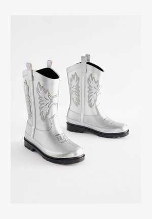 Zilverkleurige laarzen in cowboystijl met geperste bladpatronen, rubberen zolen en trekbandjes. Voorzien van een glanzende afwerking en decoratief stiksel op de schacht.