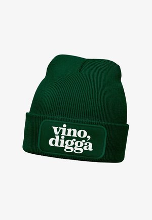 Green knitted beanie with a folded cuff displaying a rectangular patch that reads “vino, digga” in bold white text.