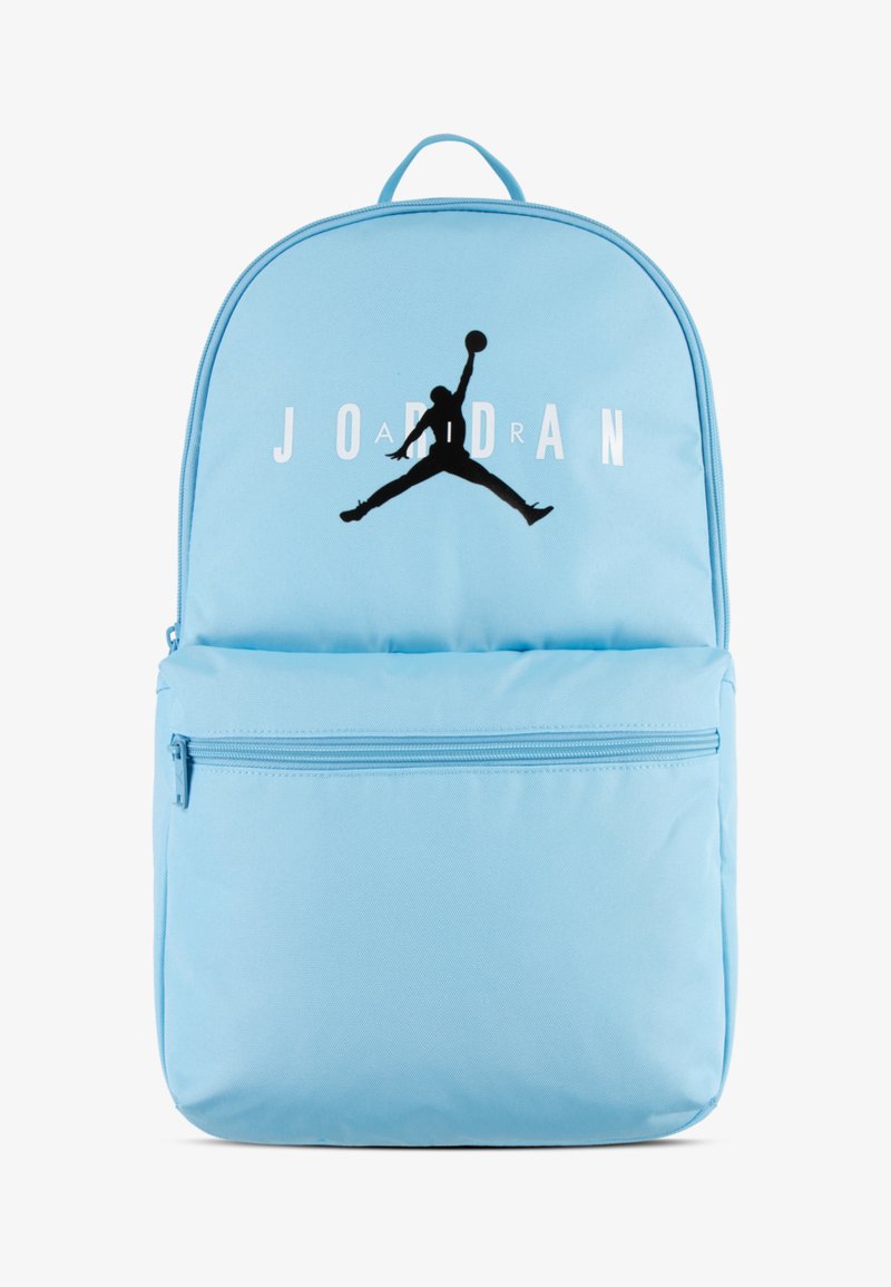 Light blue backpack made of fabric with a large black Jumpman logo and "JORDAN" printed in white. Features a front zip pocket and top handle.
