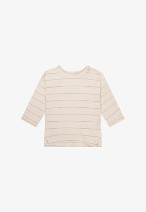 Chemise à manches longues couleur crème avec des rayures horizontales rose pâle, encolure arrondie et fentes sur les côtés. Dotée d'une fermeture à pression à l'épaule.