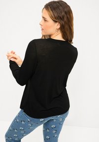 Studio Untold Maglione - schwarz