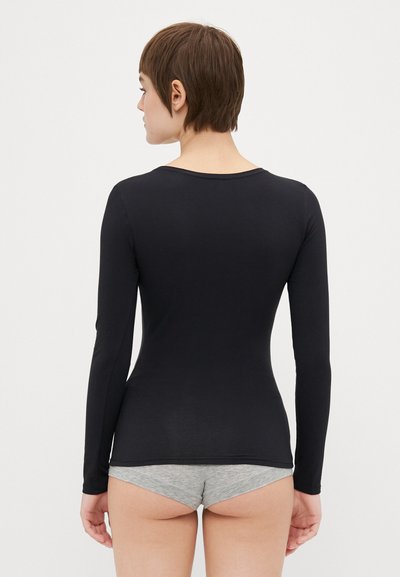 Black long-sleeve shirt made of smooth fabric, featuring a crew neckline and fitted design. Shown from the back, paired with gray shorts.