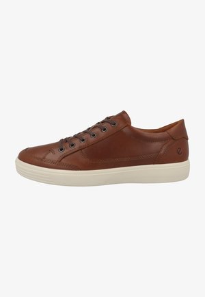 Brown leather sneaker with a low profile, round toe, and white rubber sole. Features stitched accents and metal eyelets for laces.
