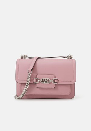 Pink leather handbag with a silver chain strap, front flap, and logo detail. Smooth texture with stitched edges and a structured shape.