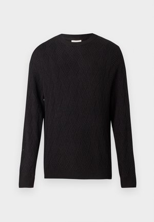 Pull noir à manches longues avec un motif en chevrons et des poignets et un ourlet côtelés, col rond, présenté sur un fond blanc uni.