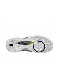 Suela de zapato de goma blanca con patrón de tracción en zigzag, que presenta un acento circular negro y una sección estriada con detalles en verde brillante.